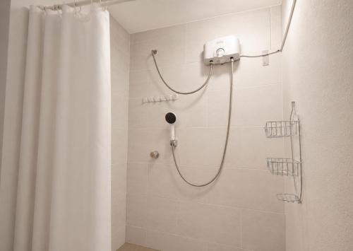 a bathroom with a shower with a shower curtain at MyAbancayHome in Abancay