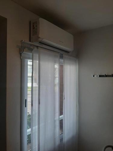 a air conditioner is on top of a window at Spa vacacional in Mar del Plata