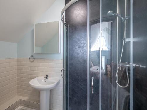 a bathroom with a shower and a sink at 4 Bed in Holsworthy oc-77663 in Milton Damerel