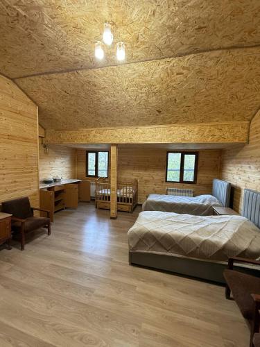a bedroom with a bed and a desk in a room at Eva Guesthouse in Odzun
