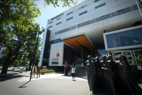 a building with a statue in front of it at Turnkey Accommodation-North Melbourne in Melbourne