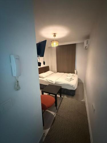 a small room with a bed and a small table at Şişli Suites - Room48 in Istanbul