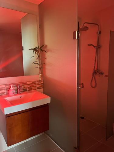 a bathroom with a sink and a shower at Le Grand Bleu in Koh Samui