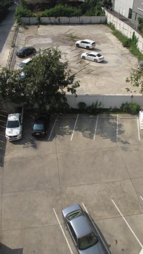 an overhead view of a parking lot with cars parked at U431 Chaengwattana in Nonthaburi