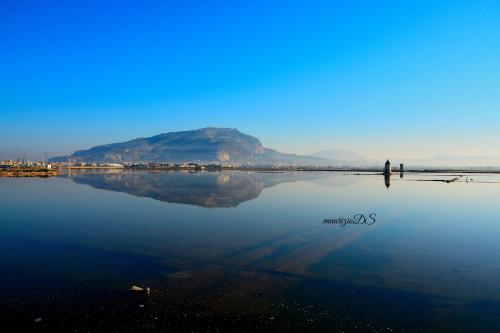 a person standing in the middle of a body of water at Le 5 Torri in Trapani