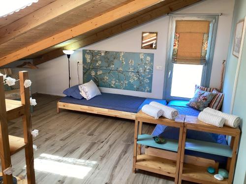 a room with a bunk bed and a ladder at Zante Villa Amici Loft in Zakynthos