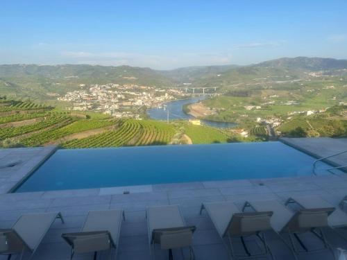 a view from the roof of a building with a river at Casa do Paço Suítes Douro Valley in Peso da Régua