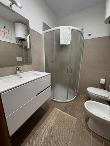 a bathroom with a shower and a sink and a toilet at La Corte del Castello in Bari