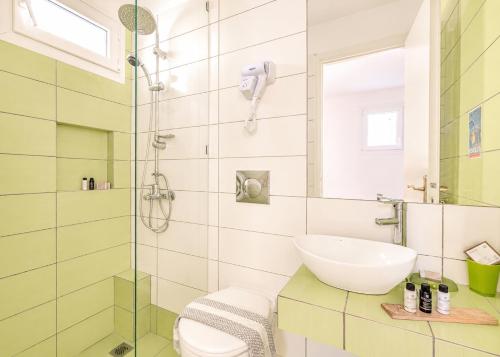a bathroom with a sink and a shower at Villa Sofia in Agios Petros