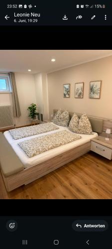 a bedroom with a large bed in a room at Haus Haslauer in Strobl