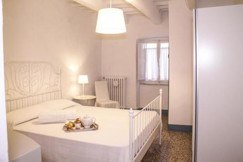 מיטה או מיטות בחדר ב-Abitare il Borgo Piazza del Popolo
