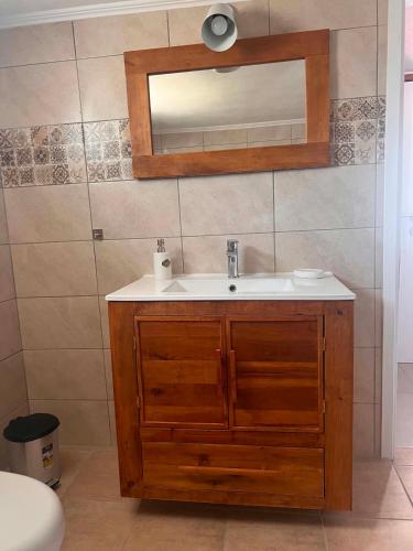 a bathroom with a sink and a mirror at Villa Harmony in Xanthi