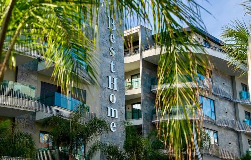 a building with a sign on the side of it at SA Apartments! Luxury Residence with Private Beach in Alanya