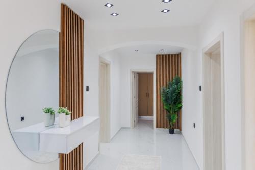 a hallway with a mirror on the wall at Villa MONTE Ulcinj in Stegvaši