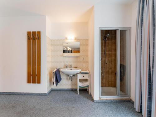 a bathroom with a sink and a shower at Nussbaumer in Niedernsill
