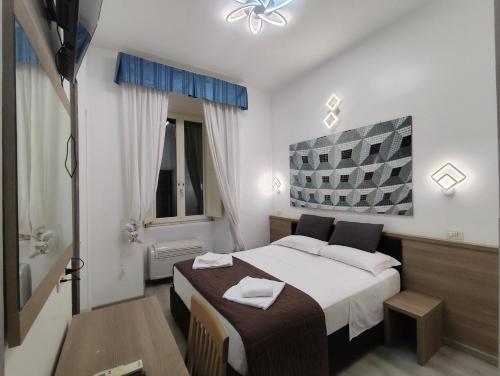 a hotel room with a bed and a bath tub at Art And Relax Suites in Rome