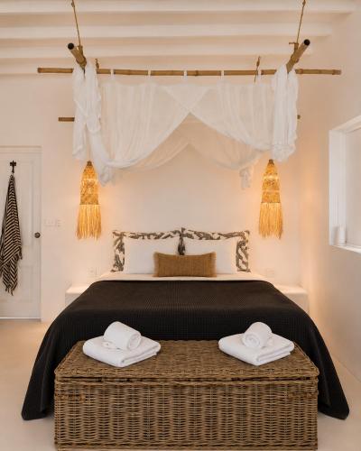 a bedroom with a bed with two towels at My Island Home Vanuatu in Eton