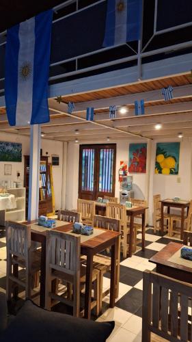 a dining room with wooden tables and chairs at HOTEL COSTANERA - Mejor Ubicacion en FORMOSA in Formosa