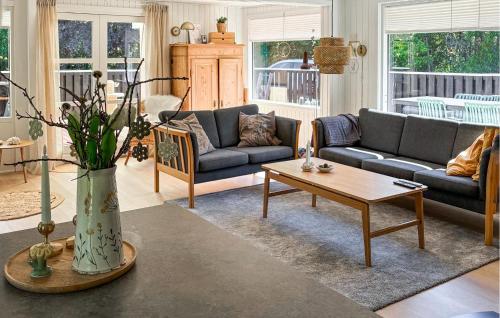 a living room with couches and a coffee table at Cozy Home In Jerup With Wifi in Jerup