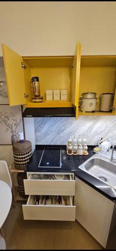 a kitchen with a sink and a counter top at Vinyce Studio in Cagayan de Oro