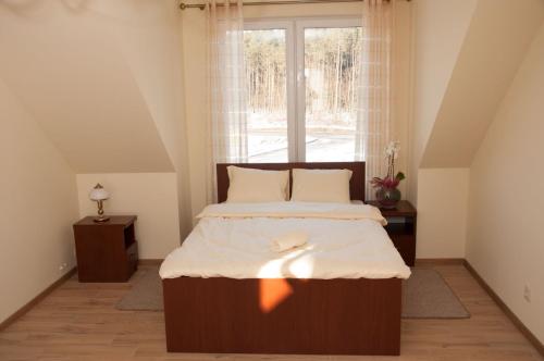 Ліжко або ліжка в номері Zajazd Antresola
