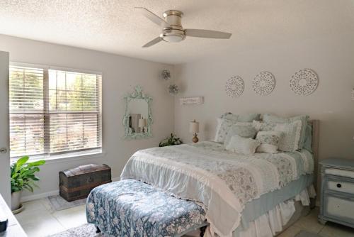 a bedroom with a bed and a ceiling fan at Roxy in Brunswick