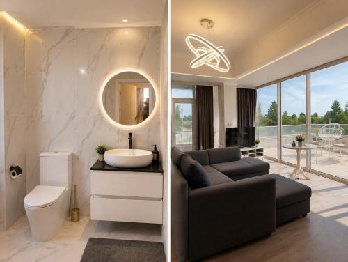a bathroom with a couch and a sink at Sakura Apartments in Astara