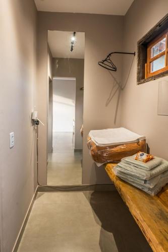 a room with two beds sitting on a table at Casa Jabu in Catas Altas