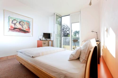 Postel nebo postele na pokoji v ubytování Hotel Watthalden