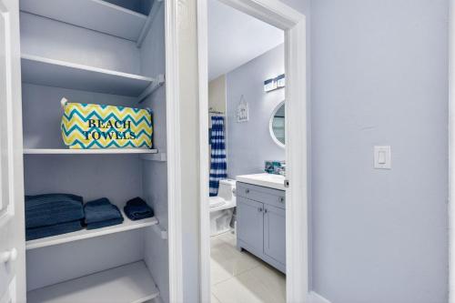 a bathroom with a toilet and a sink at Downtown Breeze in Cape Coral