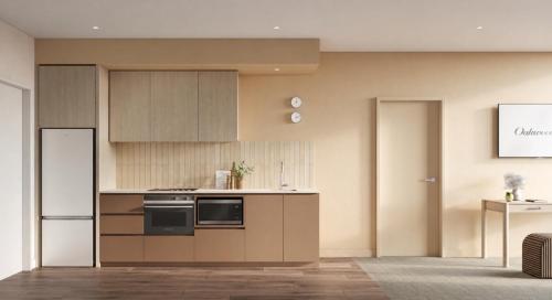 a kitchen with a stove and a refrigerator at Oakwood Epping Melbourne in Epping