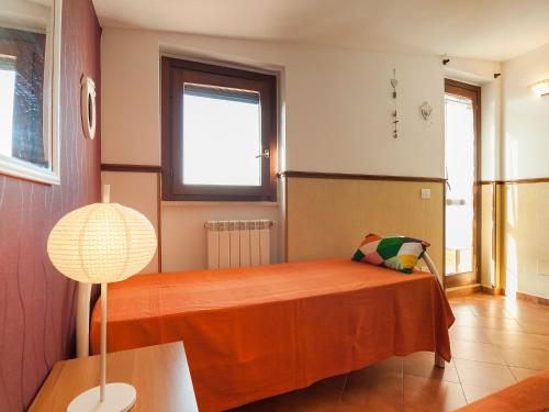 Ένα ή περισσότερα κρεβάτια σε δωμάτιο στο Casa Vacanze Calipso