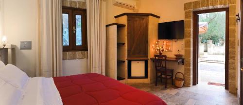 Postel nebo postele na pokoji v ubytování Masseria L'Uliveto Agri Resort