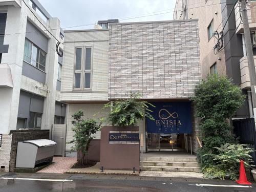 a building with a sign in front of it at ENISIA BASE Kagonma in Kagoshima