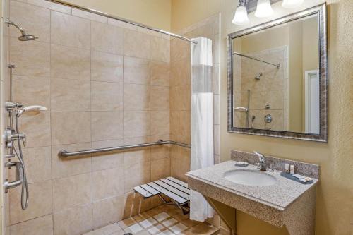 a bathroom with a sink and a shower at La Quinta by Wyndham Vicksburg in Vicksburg