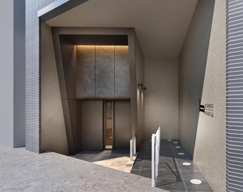 a hallway with a door in a building at B:CONTE Asakusa in Tokyo