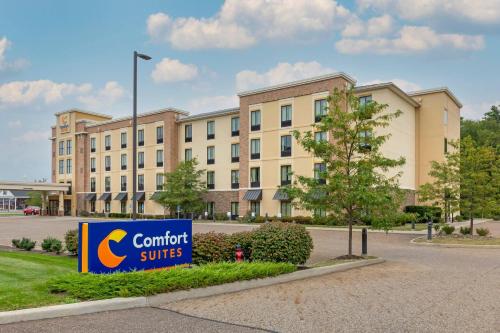 a building with a comfort suites sign in front of it at Comfort Suites Hartville-North Canton in Uniontown