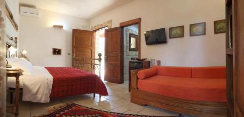 Postel nebo postele na pokoji v ubytování Masseria L'Uliveto Agri Resort