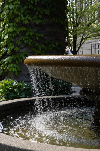 a fountain with water coming out of it at DoubleTree by Hilton North Vancouver in North Vancouver
