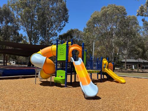 a playground with a slide in a park at Ingenia Holidays Murray Bend in Koonoomoo