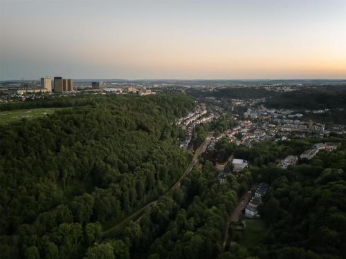 an aerial view of a city with trees at DoubleTree by Hilton Luxembourg in Luxembourg