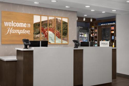 a lobby with a welcome to hampton inn hamburg at Hampton Inn Kernersville in Kernersville