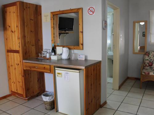 a kitchen with a counter and a refrigerator at Blommenberg in Clanwilliam