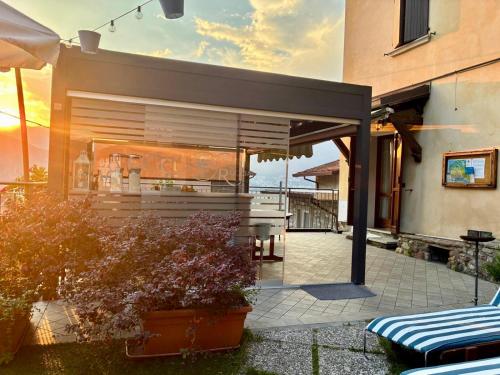 a building with a patio with a bar in it at La Casa sulla Roccia in Pisogne