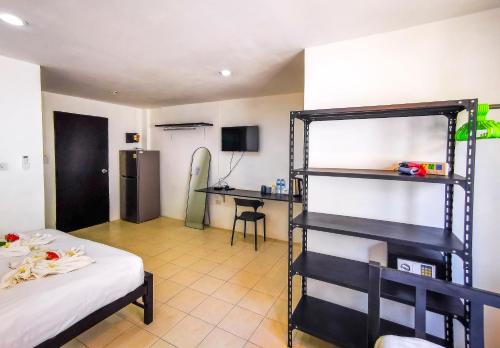 a bedroom with a bunk bed and a desk at Patong Canal Villa 208 in Patong Beach