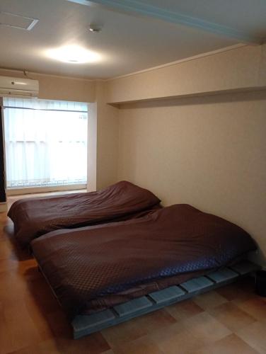 large room with 2double beds next to kuromon market