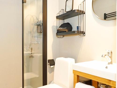 a bathroom with a toilet and a sink and a shower at Bjursås Bergsgård in Bjursås