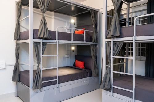 a room with bunk beds in a hostel at Loop by Zolo HSR Layout, Bangalore in Bangalore