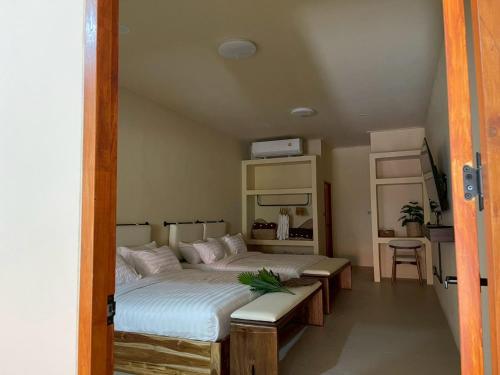 a bedroom with two beds in a room at Pani house in Ko Samed