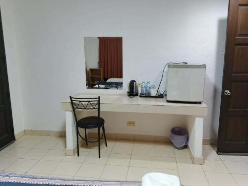 a room with a table with a appliance on it at The Royal Pattaya Cantina Near Walking Steer in Pattaya South